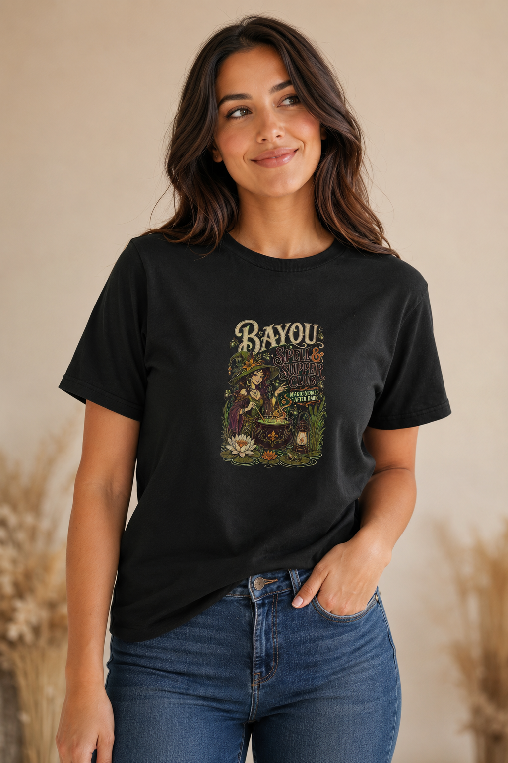 Woman wearing a black Bayou Spell & Supper Club graphic T-shirt