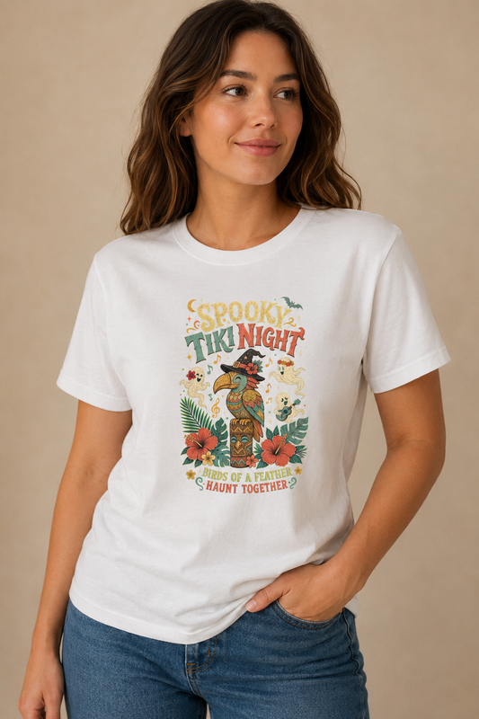 Woman wearing a white Spooky Tiki Night graphic T-shirt