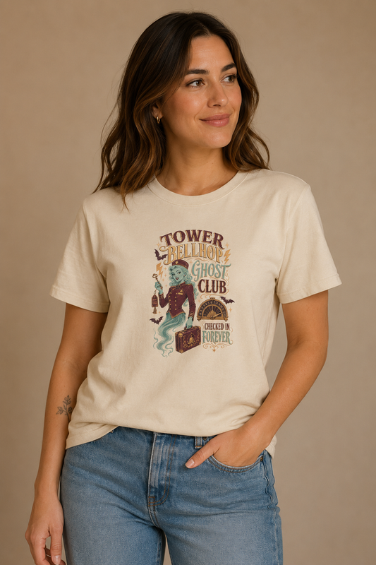 Woman wearing a beige Tower Bellhop Ghost Club graphic T-shirt
