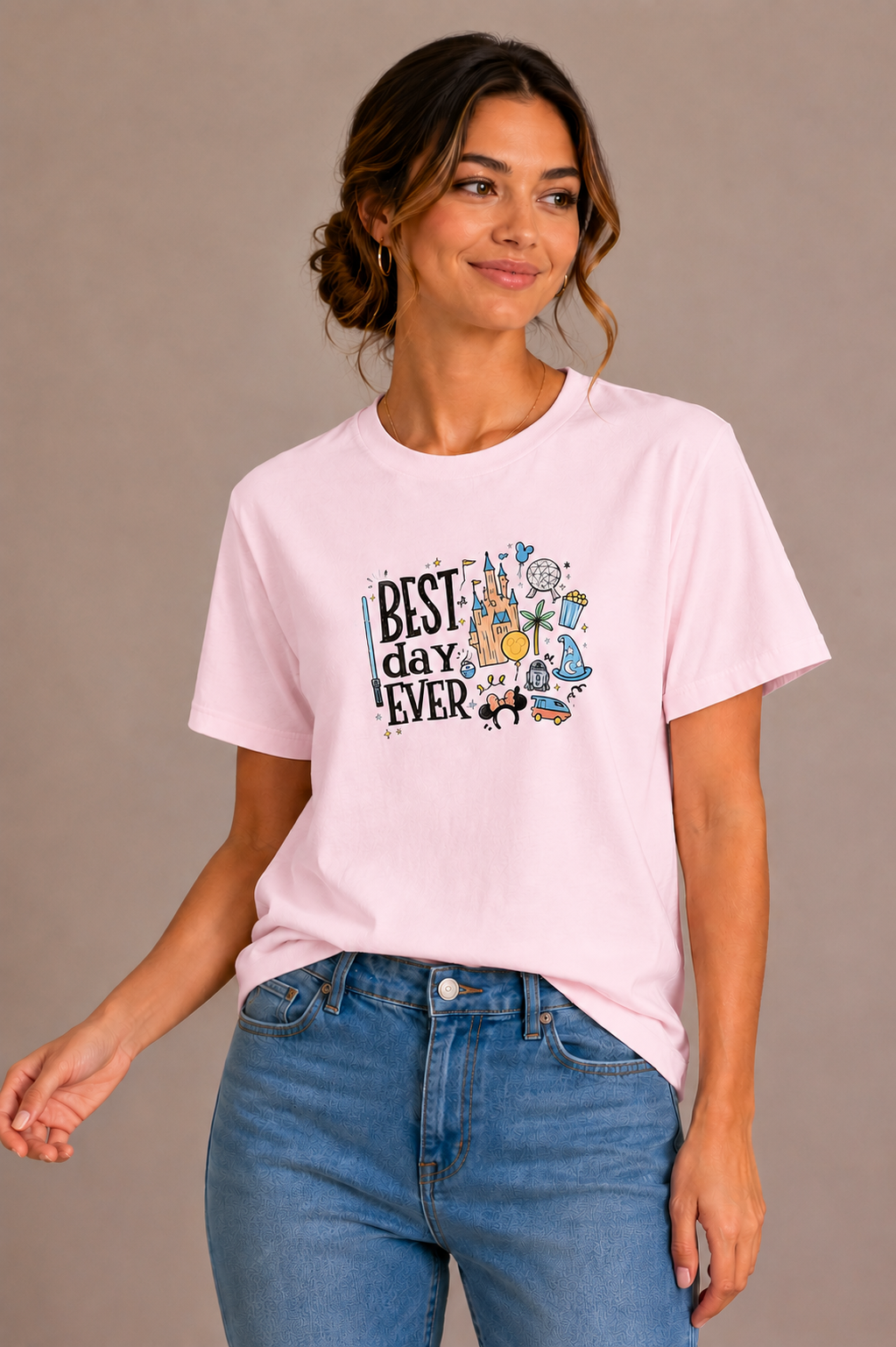 Woman wearing a pink crew-neck t-shirt with the 'Best Day Ever' theme park doodle design printed on the chest