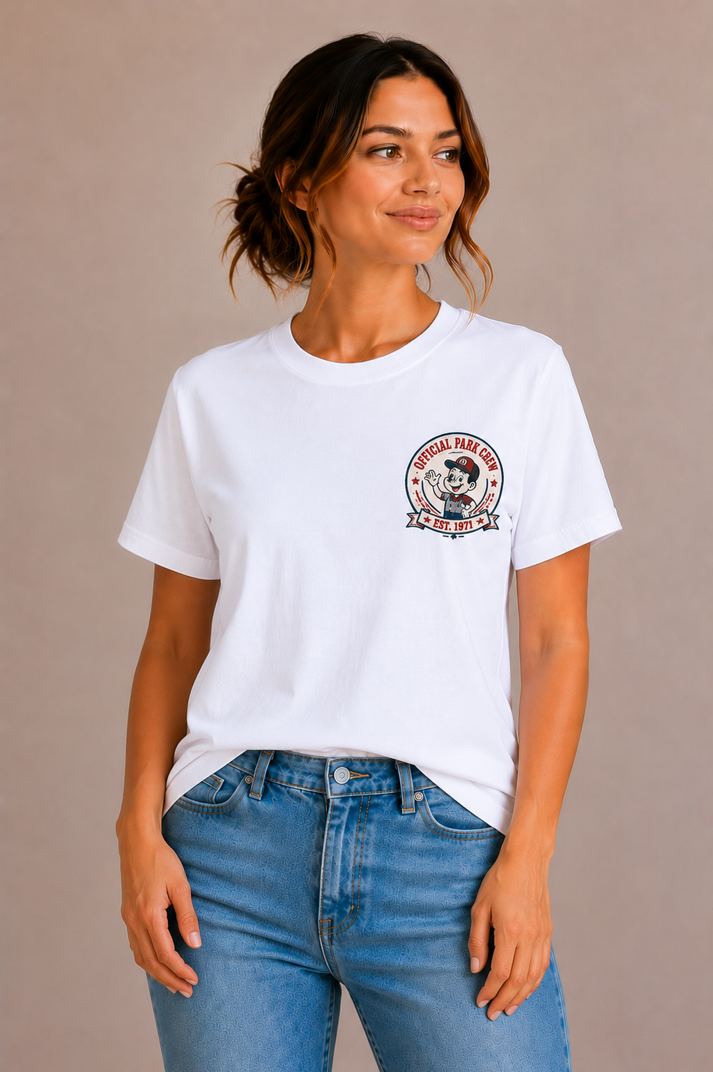 Woman wearing a white crew-neck t-shirt with the 'Official Park Crew Est. 1971' mascot badge design printed small on the chest