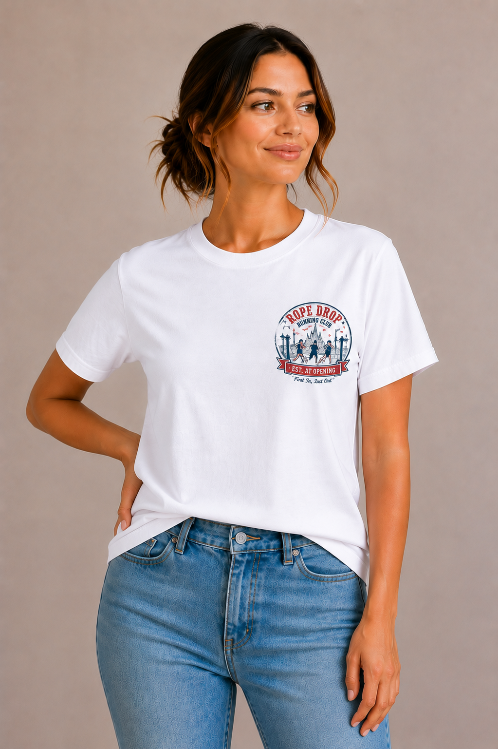 Woman wearing a white crew-neck t-shirt with the 'Rope Drop Running Club – Est. At Opening' runners badge design printed small on the chest